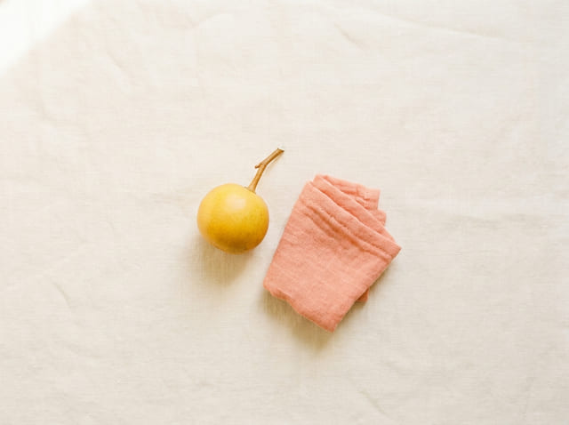 A kumquat, the size of a baby at week 10
