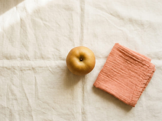 A apple, the size of a baby at week 15