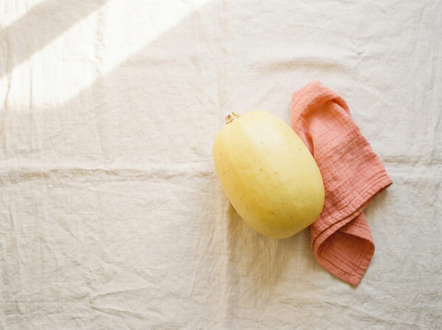 A spaghetti squash, the size of a baby at week 22