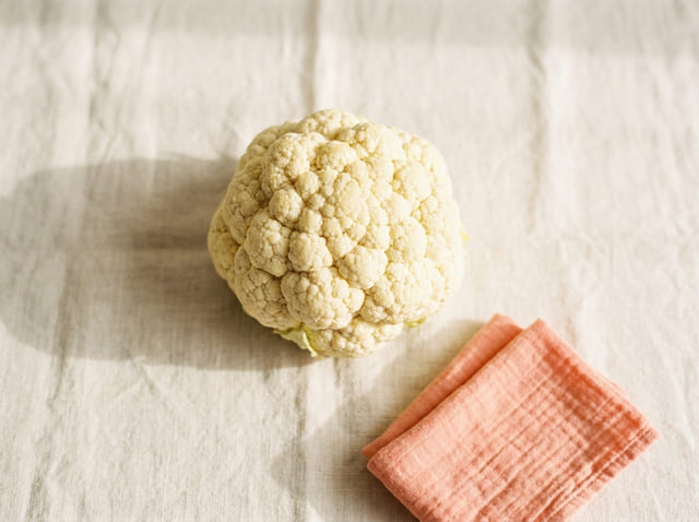 A cauliflower, the size of a baby at week 27