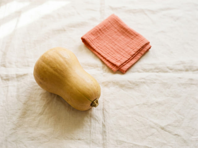 A butternut squash, the size of a baby at week 29