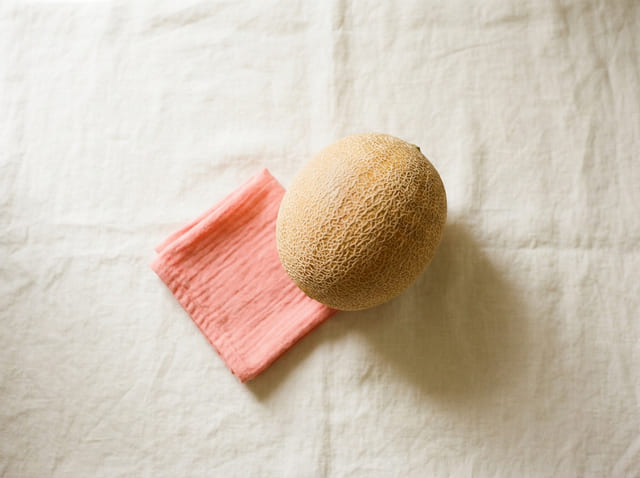 A cantaloupe, the size of a baby at week 34